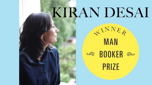 on a blue background, an image in which Kiran Desai looks to the right is overlaid to the lefthand side. On the right is a yellow sticker that says WINNER MAN BOOKER PRIZE