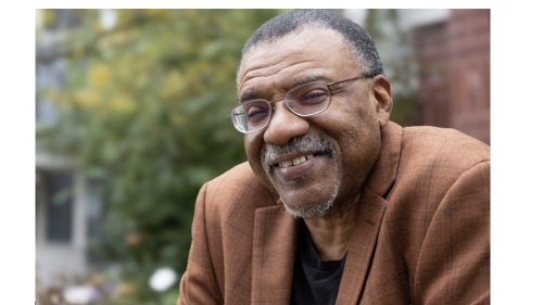 Writer Kwame Dawes in a brown shirt.