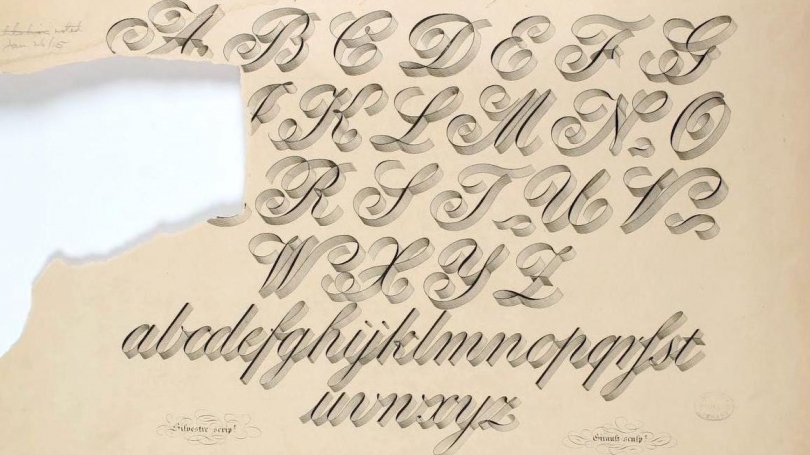 A hand lettered alphabet with a large tear on the left hand side obscuring some letters