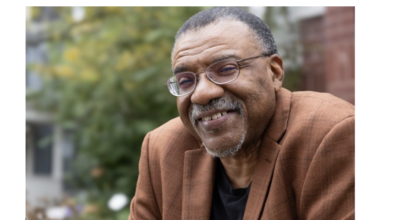 Writer Kwame Dawes in a brown shirt.